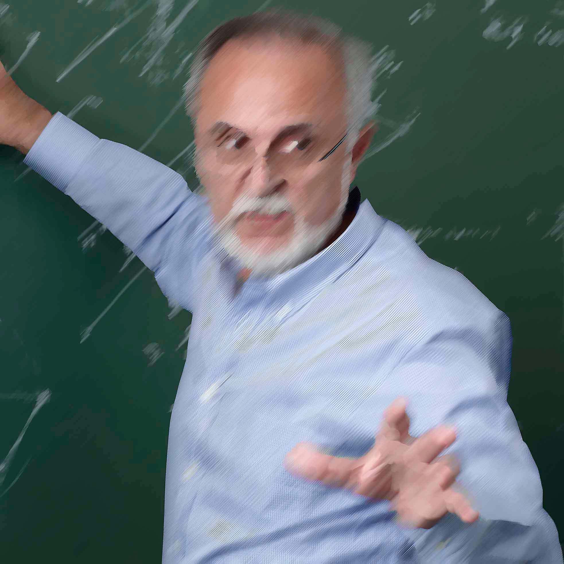Professor giving class at the blackboard